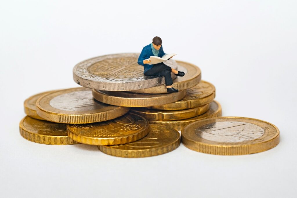 Man Sitting on Coins