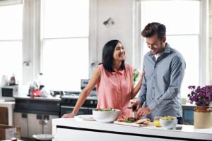 Couple Cooking Together in Kitchen