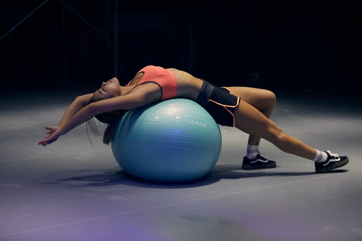 Girl Lying on Exercise Ball